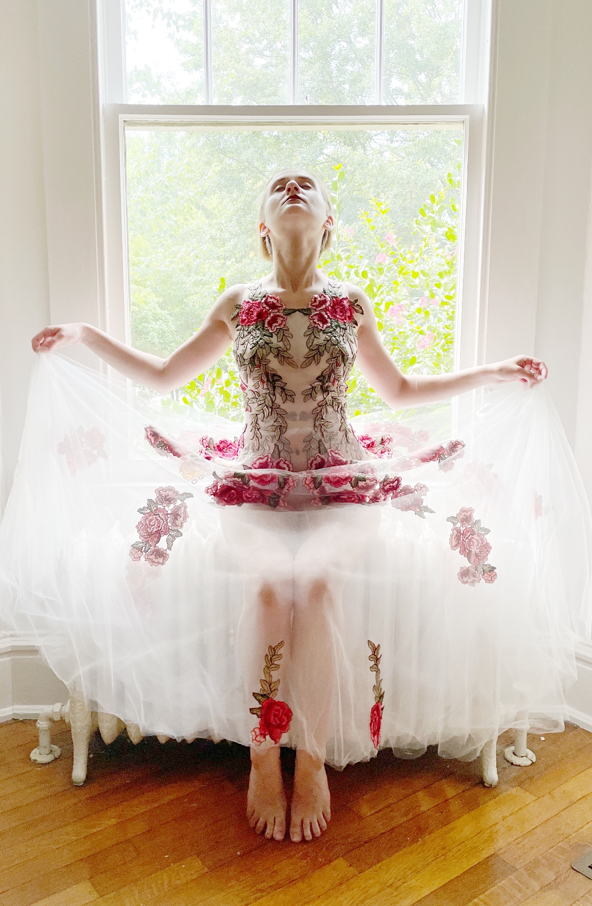 Ivory tulle custom gown with red lace appliqué